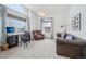 Bright home office with large windows, comfortable seating, and a functional desk area at 6281 Mcintyre Way, Golden, CO 80403