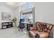 Inviting home office with ample natural light, a comfortable armchair, and a functional workspace at 6281 Mcintyre Way, Golden, CO 80403