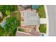 Bird's eye view of a home with a backyard featuring a deck, patio, mature trees, and stone landscaping at 5075 Weeping Willow Cir, Highlands Ranch, CO 80130
