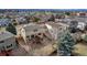 A cozy backyard with a wooden deck perfect for outdoor relaxation and entertaining guests in the shade at 5075 Weeping Willow Cir, Highlands Ranch, CO 80130