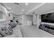 Spacious finished basement with neutral carpet, a bar area, recessed lighting, and a comfortable sofa at 5075 Weeping Willow Cir, Highlands Ranch, CO 80130