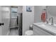 Bathroom features a modern sink, stackable washer and dryer, and stylish decor at 5075 Weeping Willow Cir, Highlands Ranch, CO 80130
