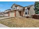Attractive two-story home with brick accents, a two-car garage, and a landscaped yard at 5075 Weeping Willow Cir, Highlands Ranch, CO 80130