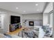 Comfortable living room with a fireplace and entertainment center at 5075 Weeping Willow Cir, Highlands Ranch, CO 80130