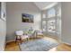 Bright living room featuring a vaulted ceiling, large arched window, and hardwood floors at 5075 Weeping Willow Cir, Highlands Ranch, CO 80130