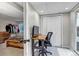 Office with a desk, chair, a view to the exterior, and adjacent to an open bedroom with closet at 5075 Weeping Willow Cir, Highlands Ranch, CO 80130