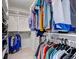 Spacious walk-in closet featuring shelving and hanging racks for organized storage and convenience at 5075 Weeping Willow Cir, Highlands Ranch, CO 80130