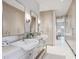 Stylish bathroom with dual sinks, generous counter space, and plenty of storage at 1201 N Williams St # 4C, Denver, CO 80218