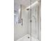 Modern bathroom showcasing a walk-in shower with gray tiled walls and glass door at 1201 N Williams St # 4C, Denver, CO 80218