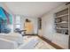 Cozy bedroom featuring a comfortable couch, storage, and modern decor at 1201 N Williams St # 4C, Denver, CO 80218