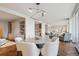 Open-concept dining room boasts herringbone floors, modern lighting, and easy access to the kitchen at 1201 N Williams St # 4C, Denver, CO 80218
