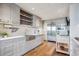 Well-appointed kitchen features stainless appliances, bright white countertops, and custom cabinets at 1201 N Williams St # 4C, Denver, CO 80218