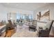 Bright living room with modern furniture, hard wood floors, neutral colors, and city views at 1201 N Williams St # 4C, Denver, CO 80218