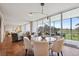 Spacious living room with floor to ceiling windows offering golf course views at 1201 N Williams St # 4C, Denver, CO 80218