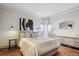 Bright main bedroom featuring a neutral palette, wood floors, and modern decor at 1201 N Williams St # 4C, Denver, CO 80218