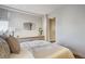 Serene bedroom with a plush bed, dresser, and soft lighting at 1201 N Williams St # 4C, Denver, CO 80218