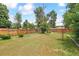 Large, fenced back yard offers privacy, green space and mature trees at 1708 Akron St, Aurora, CO 80010