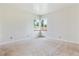 Spacious bedroom with a window providing natural light and a view at 1708 Akron St, Aurora, CO 80010