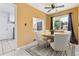 Dining Area features a new ceiling fan and a window with natural light at 1708 Akron St, Aurora, CO 80010