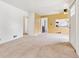 Open living room with great natural light leads into the adjacent dining area and kitchen at 1708 Akron St, Aurora, CO 80010