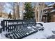 Snowy bench that reads 