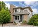 Contemporary home with stone accents, well-maintained landscaping, and a welcoming entrance at 3473 Beeler St, Denver, CO 80238