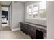 Hallway with a built-in desk, dark wood cabinets, and view of the bedroom at 3473 Beeler St, Denver, CO 80238