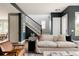 Inviting living room with hardwood floors, a modern staircase, and stylish furnishings create a cozy atmosphere at 3473 Beeler St, Denver, CO 80238