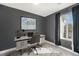 Staged office area in bedroom featuring gray walls, a window, and carpeting at 4076 S Carson St # H, Aurora, CO 80014