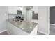 Bright kitchen features gray granite countertops, subway tile backsplash, and stainless steel appliances at 4076 S Carson St # H, Aurora, CO 80014