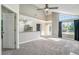 Bright living room features vaulted ceilings, large windows, and open access to the kitchen at 4076 S Carson St # H, Aurora, CO 80014