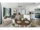 Staged view of the open-concept living room, dining room, and kitchen at 4076 S Carson St # H, Aurora, CO 80014