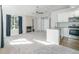 Bright living room with vaulted ceiling, gas fireplace, kitchen access and large picture window at 4076 S Carson St # H, Aurora, CO 80014