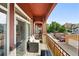 Spacious balcony offering views of the neighborhood and surrounding trees at 2100 N Humboldt St # 208, Denver, CO 80205