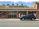 Exterior shot of Beyond Thai Cafe, featuring a modern storefront with a blue car parked outside at 2100 N Humboldt St # 208, Denver, CO 80205