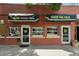 Charming storefront with colorful awnings reading Coffee Bakery Cafe and Green Bus Cafe at 2100 N Humboldt St # 208, Denver, CO 80205