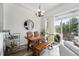 Cozy dining area featuring wooden table, bench, and slider doors, for indoor-outdoor living at 2100 N Humboldt St # 208, Denver, CO 80205