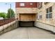 Image of a building featuring the entrance to the underground parking garage at 2100 N Humboldt St # 208, Denver, CO 80205