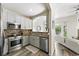 Modern kitchen with stainless steel appliances, granite countertops, and stylish tile backsplash at 2100 N Humboldt St # 208, Denver, CO 80205
