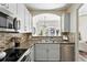 Modern kitchen with stainless steel appliances, granite countertops, and convenient access to dining area at 2100 N Humboldt St # 208, Denver, CO 80205