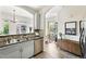 Bright kitchen offering stainless steel appliances, stylish tile backsplash and pass-through to living area at 2100 N Humboldt St # 208, Denver, CO 80205