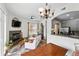 Open-concept living space with dining area, fireplace, access to kitchen and abundant natural light at 2100 N Humboldt St # 208, Denver, CO 80205