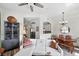 Open living space with seating, fireplace, dining area, bar cabinet, and views to the kitchen at 2100 N Humboldt St # 208, Denver, CO 80205