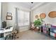 Well-lit office space with a plant, stylish decor, and comfortable chair at 2100 N Humboldt St # 208, Denver, CO 80205