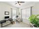 Bright office features a plant, two windows, and dual modern workspaces at 2100 N Humboldt St # 208, Denver, CO 80205