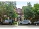 Attractive building featuring beautiful architecture complemented by mature trees and street parking at 2100 N Humboldt St # 208, Denver, CO 80205