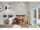 Dining area with view of staircase and backyard access at 12844 W Cross Dr, Littleton, CO 80127