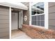 Front door entrance with brick wall and welcome sign at 12844 W Cross Dr, Littleton, CO 80127