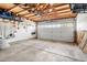 Clean and organized garage with ample storage and overhead shelving at 12844 W Cross Dr, Littleton, CO 80127