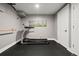 Basement gym featuring a treadmill and wall-mounted equipment at 12844 W Cross Dr, Littleton, CO 80127